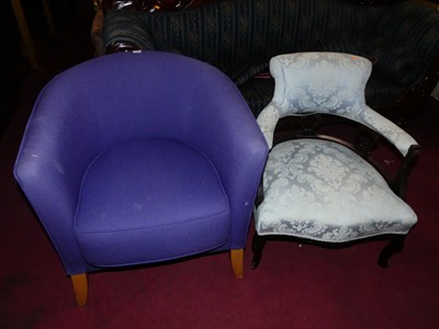 Lot 1369 - A contemporary purple upholstered tub chair,...