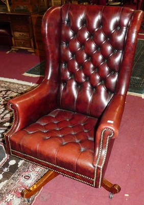 Lot 1351 - A burgundy buttoned leather upholstered and...