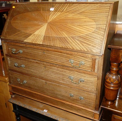 Lot 1386 - An Edwardian mahogany slopefront three drawer...