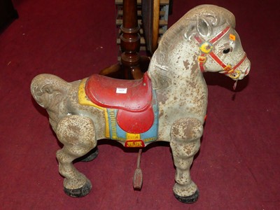 Lot 1429 - A painted and pressed metal child's horse