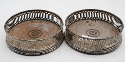 Lot 542 - A pair of modern silver bottle coasters, of...