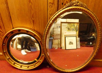 Lot 1053 - Reproduction gilt framed convex wall mirror,...