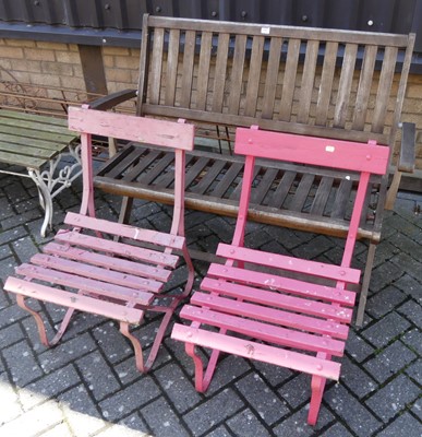 Lot 1440 - A contemporary folded slatted teak two-seater...