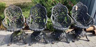 Lot 1456 - A set of four black painted floral pierced...