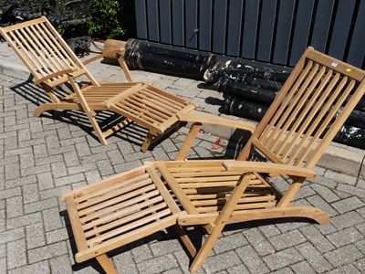 Lot 1453 - A pair of contemporary slatted teak folding...