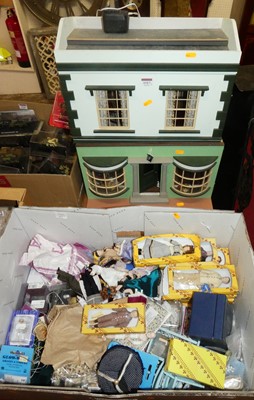 Lot 1517 - A two-storey dolls house with a box of various...