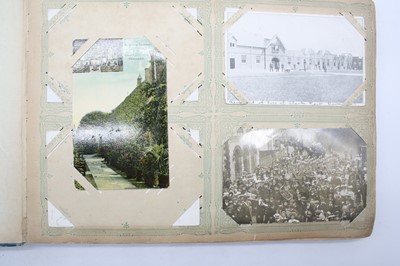 Lot 568 - An early 20th century postcard album, the...