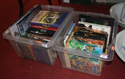 Lot 720 - Two boxes of Terry Pratchett novels, to...