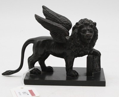 Lot 617 - A reproduction bronze figure of a winged lion,...