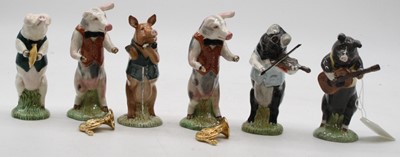 Lot 619 - A collection of six Beswick pig musician...