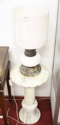 Lot 631 - An alabaster table lamp, having a cylindrical...