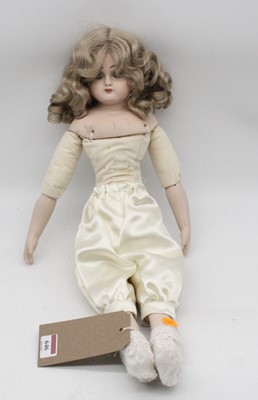 Lot 646 - A German style bisque head and shoulders doll,...