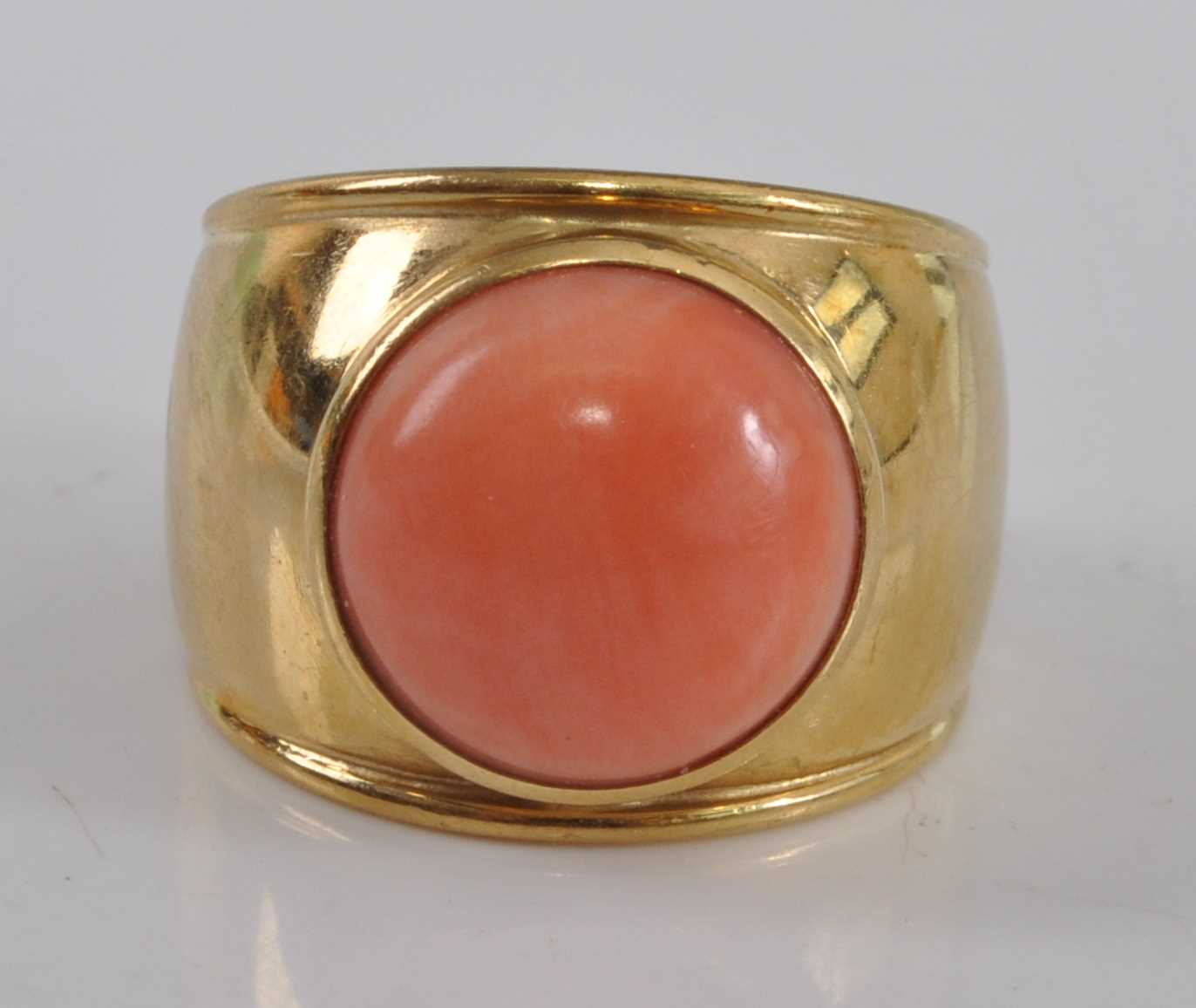 Lot 2502 - A yellow metal coral dress ring, comprising a...