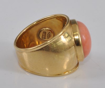 Lot 2502 - A yellow metal coral dress ring, comprising a...