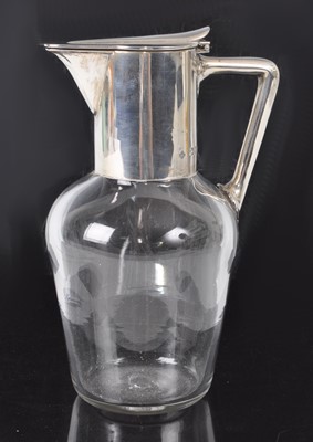 Lot 146 - A Circa 1900 silver topped claret jug, the...