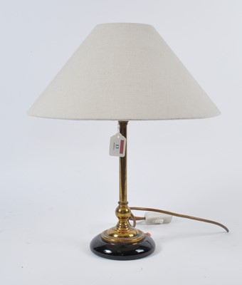 Lot 13 - A 20th century brass table lamp, having cream...