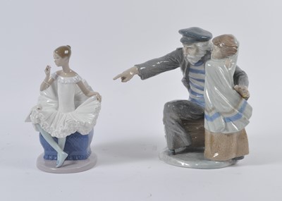 Lot 32 - A Nao porcelain figure group of an old man...