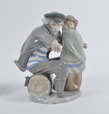 Lot 32 - A Nao porcelain figure group of an old man...