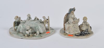 Lot 38 - Two studio pottery figure groups, each with...
