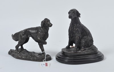 Lot 47 - Two modern bronzed models of spaniels, the...