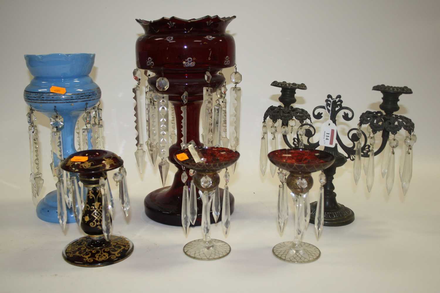 Lot 114 - A Victorian cranberry glass table lustre,...