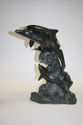 Lot 117 - A modern verdigris metal model of a leaping...