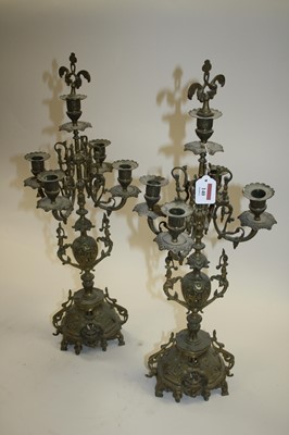 Lot 140 - A pair of 19th century brass four-branch table...