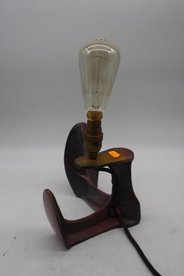 Lot 175 - A cast iron shoe-last converted into a table lamp