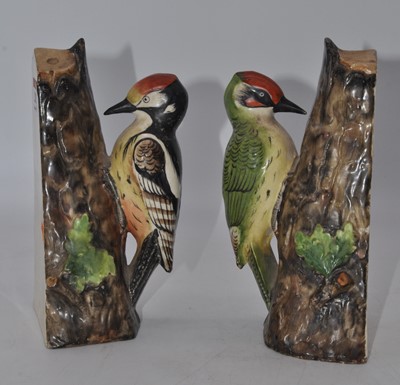 Lot 202 - A pair of 20th century pottery book-ends, each...