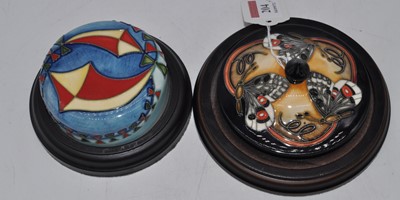 Lot 204 - Two tube-line decorated paperweights, one...