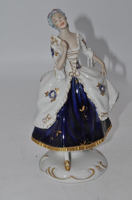 Lot 215 - A Royal Dux porcelain figure of a lady, in...
