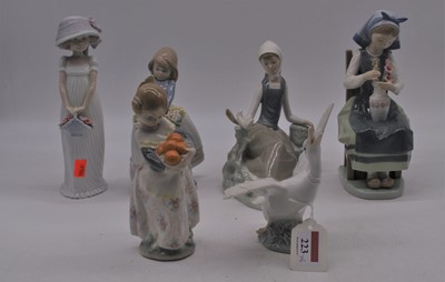 Lot 223 - A collection of Lladro porcelain figures, the...