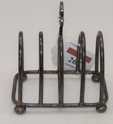 Lot 265 - A George VI silver four-division toast rack,...