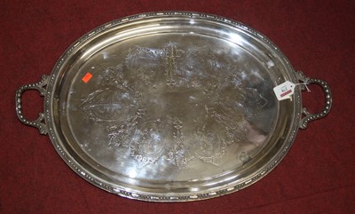 Lot 278 - A silver plated twin handled serving tray,...
