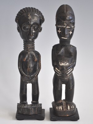 Lot 187 - A pair of ancesestor figures, carved as a male...