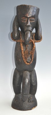 Lot 184 - A large wooden fetish or ritual figure, carved...