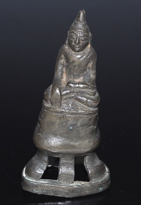 Lot 2444 - A small cast bronze figure of the Buddha...