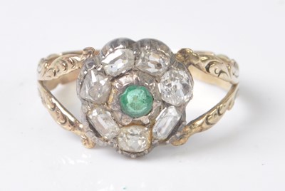 Lot 2509 - A yellow and white metal, emerald and diamond...