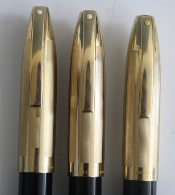 Lot 118 - Three Sheaffer PFM V fountain pens, in black...