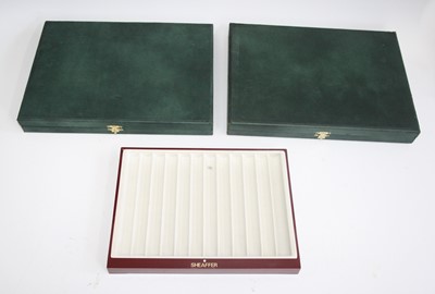 Lot 177 - Two green rubber covered pen cases, together...