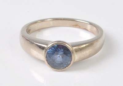 Lot 2203 - An 18ct white gold sapphire dress ring, the...