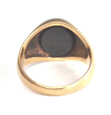 Lot 2514 - A 9ct yellow gold oval bloodstone set signet...