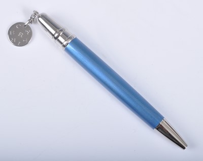 Lot 201 - A cased Cartier purse ballpoint pen with charm,...