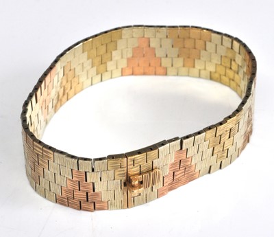Lot 2198 - A 9ct yellow, white and rose gold textured...