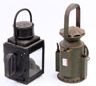 Lot 70 - Two railway lamps, to include a military green...