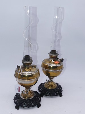 Lot 32 - A pair of 20th century eastern brass oil lamps,...