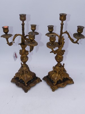 Lot 36 - A pair of Rococo style gilt metal four sconce...