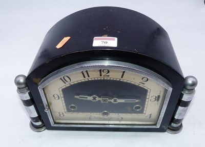 Lot 70 - An Art Deco mantel clock, having ebonised and...