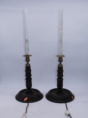 Lot 122 - A pair of 20th century oak table lamps, having...