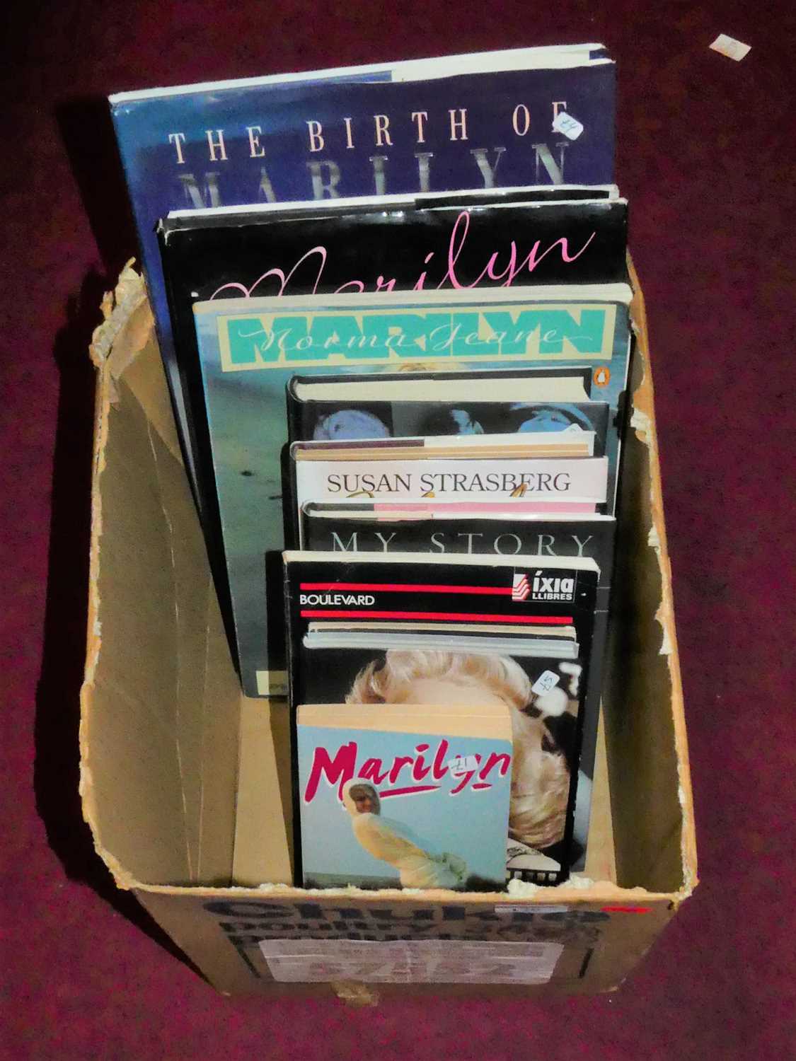 Lot 176 - A box of books relating to Marilyn Monroe, to...